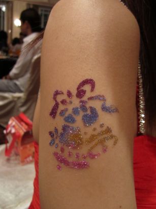 Glitter Arm Pic Tattoo